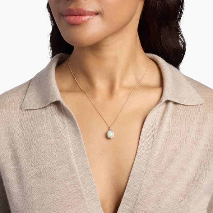Oval Opal with Blue and White Topaz Halo Pendant in 14k Rose Gold