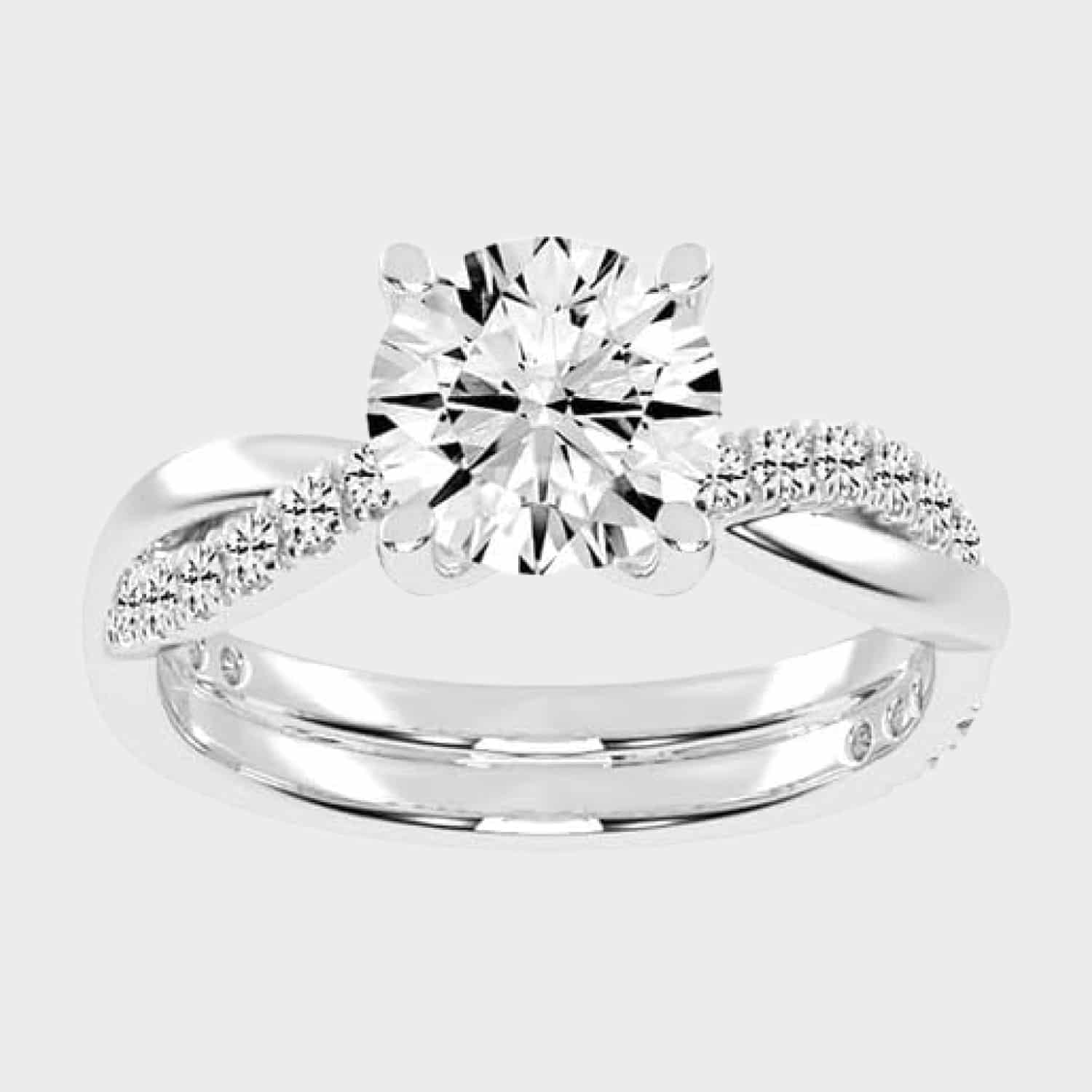 Shop 1 carat twisted-style solitaire lab-grown diamond engagement rings below $1000 in 14k white gold or platinum. F-G color, VS1-VS2 clarity.
