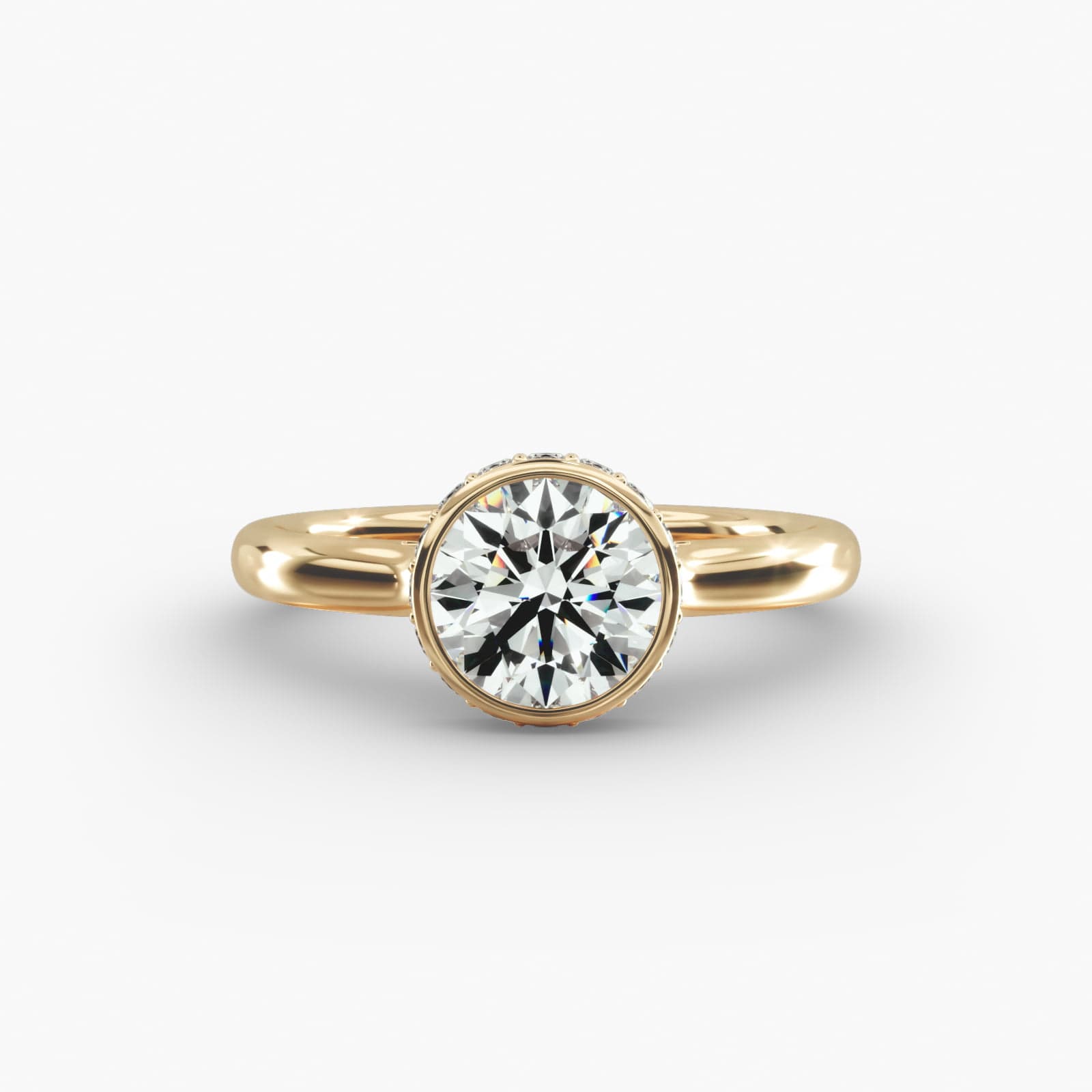 The Pavé Crown Bezel Solitaire hidden halo engagement ring in 14k yellow gold.