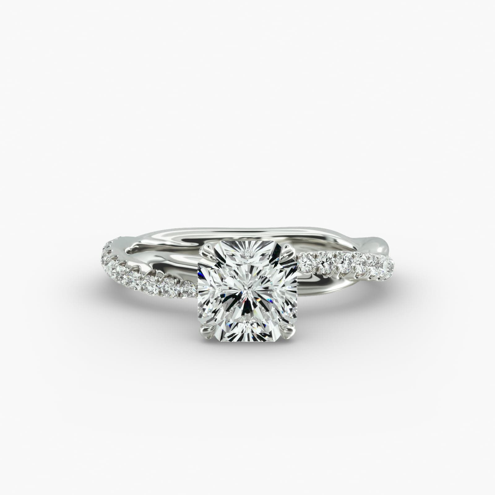 A close-up side view of a 2 carat radiant cut diamond ring, highlighting the G-VS1 clarity of the center stone and the detailed Pavé Rope setting.