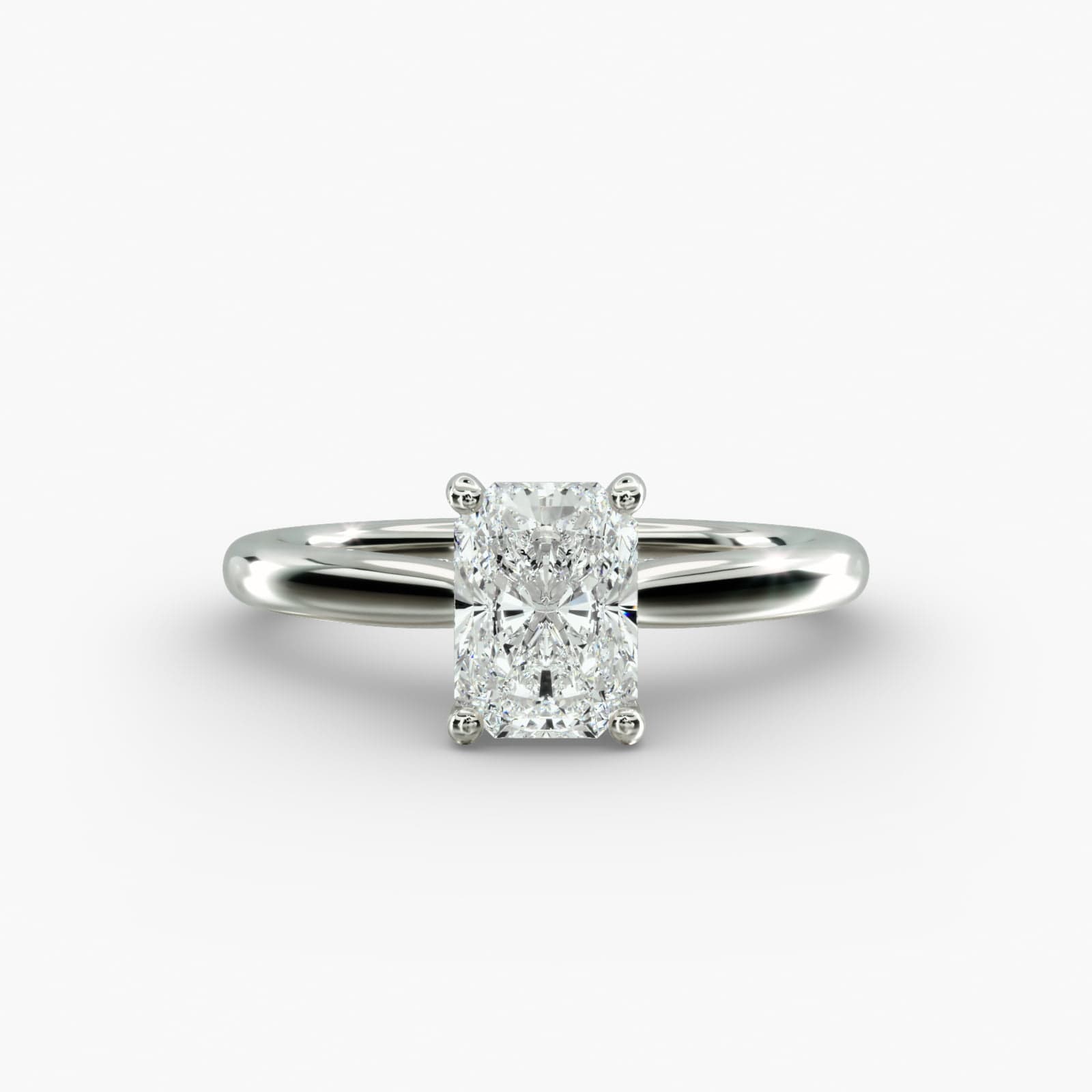 A close-up side view of a 6 ct radiant cut diamond ring, showcasing the delicate 1.60mm band and the hidden halo accent diamonds.