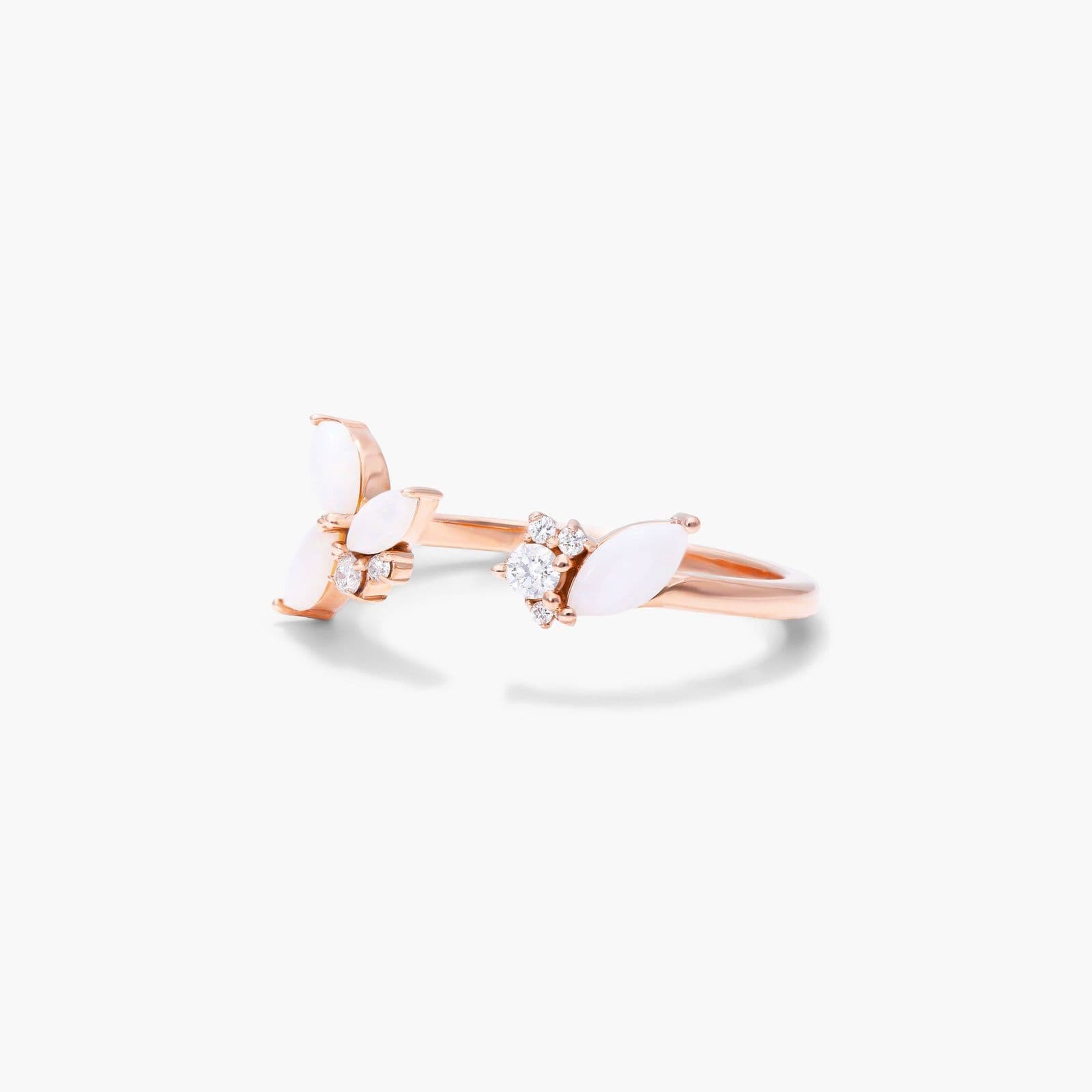 A 14K Rose Gold Open Ring Opal Wedding Rings For Women with asymmetrically set Marquise Cabochon Opals (0.46 CTW min) and Round Diamond accents.