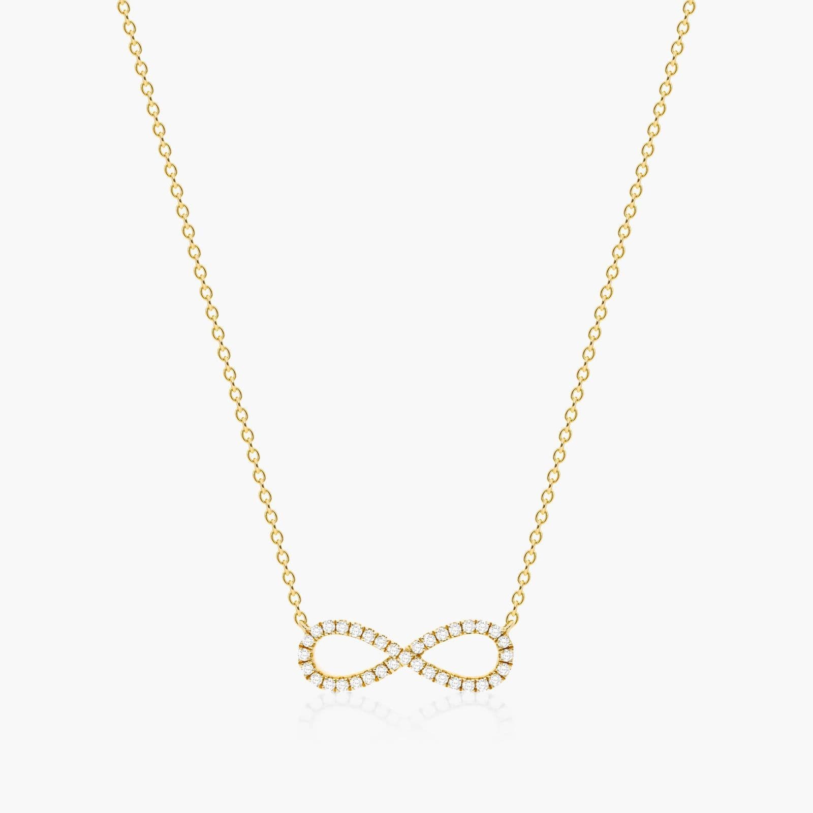 14K yellow gold infinity necklaces valentine's day jewelry for her featuring a diamond pavé infinity symbol on a 16-inch cable chain.