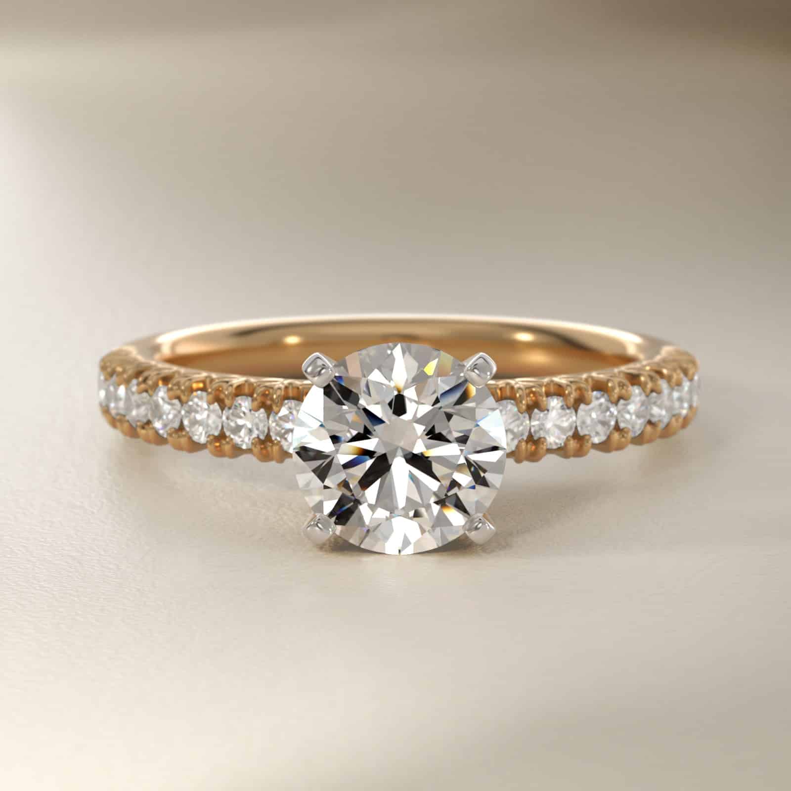 14K yellow gold French pavé engagement rings under $2,500 featuring a 1 carat round lab grown diamond and 16 natural diamond accents.
